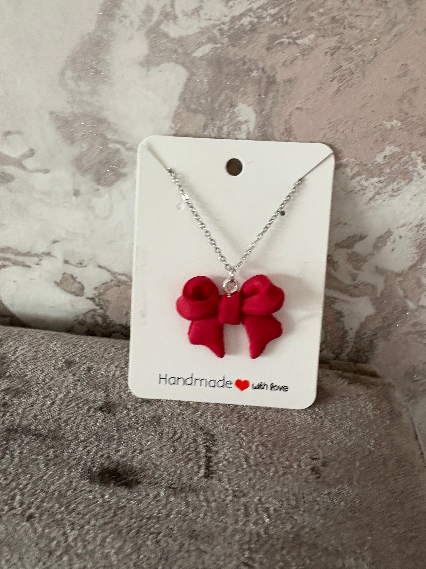 Handmade polymer clay bow necklace