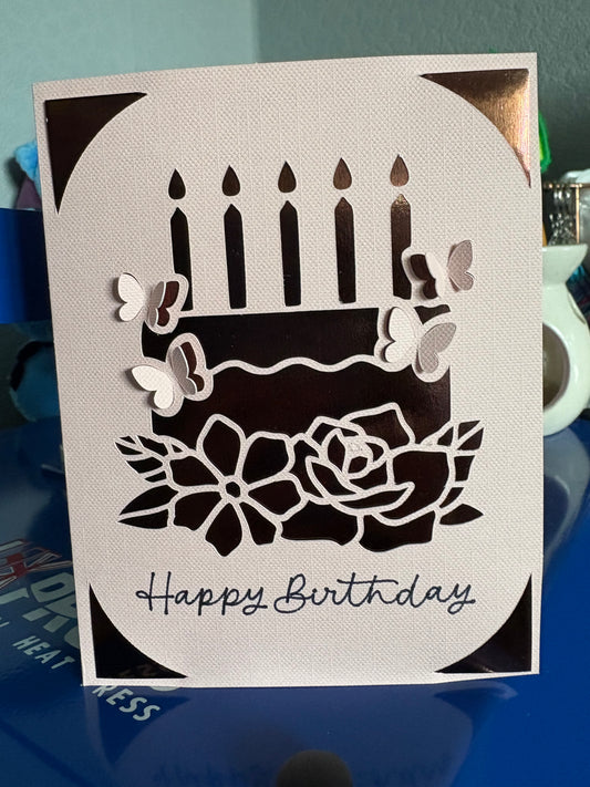 Handmade happy birthday card with cake flowers on